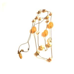 Long gold and neutral beaded necklace